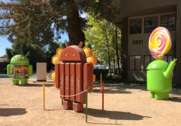 Groups of statues representing different versions of the Android operating system like KitKat.