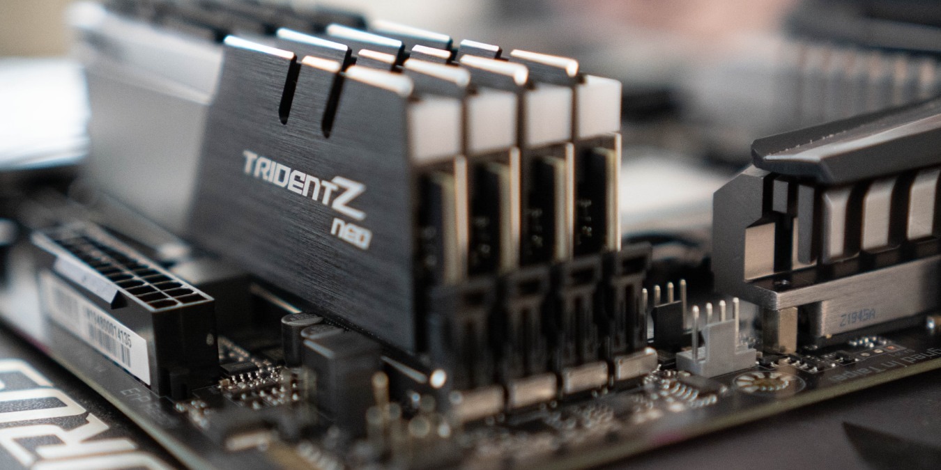 RAM close up showing four memory sticks on a a motherboard