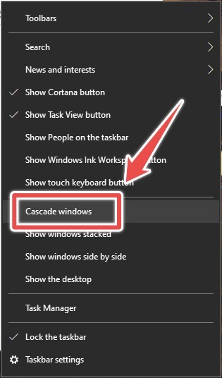 Selecting "Cascading Windows" option from taskbar in Windows 10.
