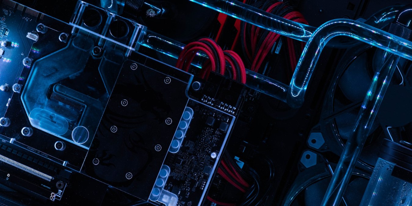 Close up of a motherboard with custom watercooling loop