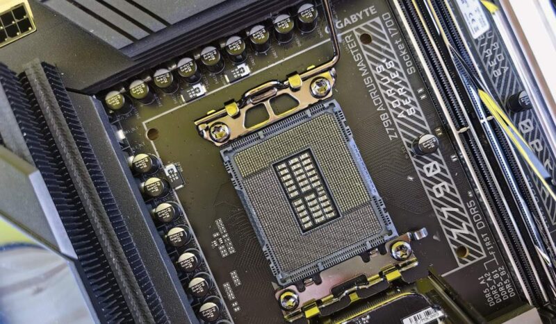 Closeup of a motherboard showing the processor socket and RAM slots
